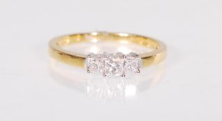 A stamped 18ct gold ladies ring set with three gra