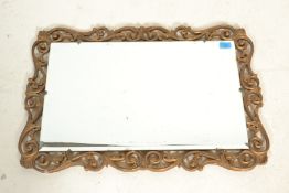 A vintage 20th Century decorative gilt framed mirr