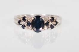 A HALLMARKED 9CT GOLD SAPPHIRE AND DIAMOND RING