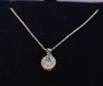 A ladies 18ct white gold pendant necklace set with