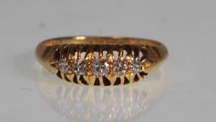 AN HALLMARKED 18CT GOLD AND DIAMOND 5 STONE RING