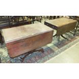 An early-19th century mahogany Pembroke table with end drawer, on turned column and reeded sabre