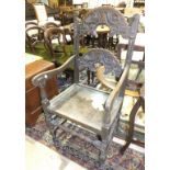 An oak armchair in the Jacobean style, a small Edwardian mahogany fold-over card table and a