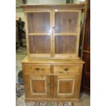 A pine dresser base fitted with two drawers above two cupboard doors, 109cm wide, 84cm high, 46cm