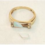 A modern 14ct yellow gold ring set opal baton, (a/f, in two pieces), between diamond-set