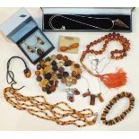 A silver and amber pendant and earring set, other silver and amber jewellery, amber beads, etc, (