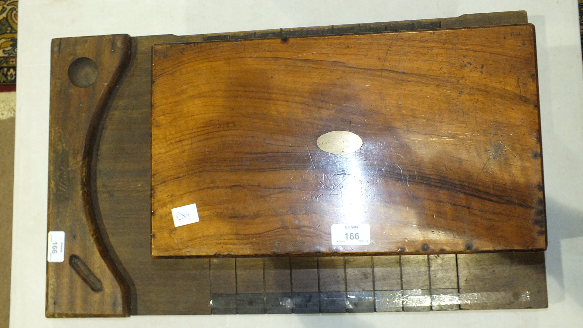 A Wisdens wooden Shove Halfpenny board, (a/f), 61 x 36.5cm and a Late-Victorian walnut writing