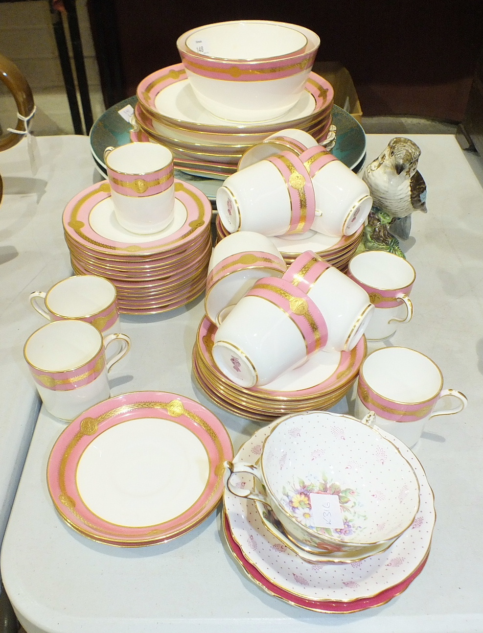 A Mintons pink and gilt tea part-set, approximately 50 pieces, a Beswick model of a Kookaburra and