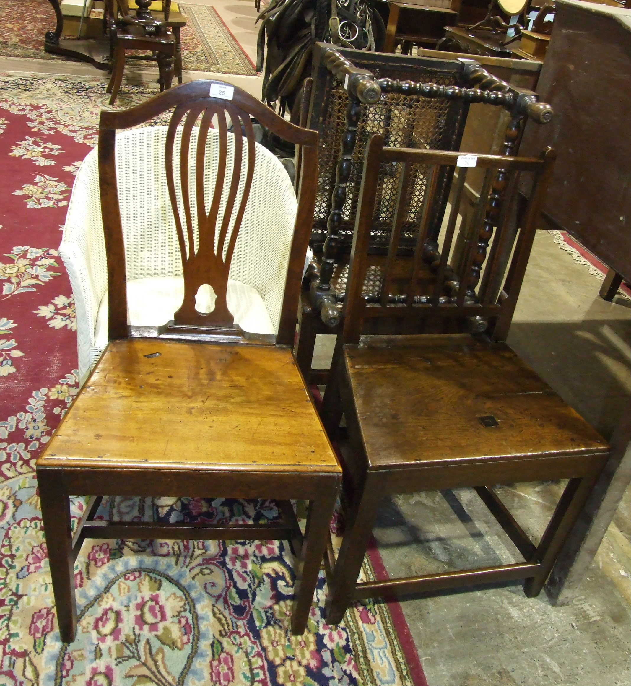 A pair of 19th century mahogany wood-seated brander back dining chairs on square front legs, one