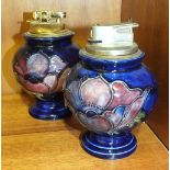 Two Moorcroft baluster-shaped blue-glazed table lighters decorated in the Anemone pattern, 12cm