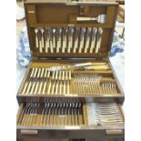 A Mappin & Webb twelve-place canteen of plated cutlery in fitted oak case with drawer, (one fish