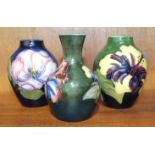 A small Moorcroft blue-glazed ovoid shape vase decorated in the Magnolia pattern, 8.5cm high, a