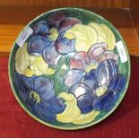 A Moorcroft green-glazed bowl decorated in the Clematis pattern, impressed factory mark and