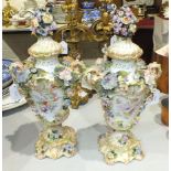 A pair of late-19th century Continental flower-encrusted vases and covers, 41cm high, (some