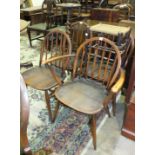 A stained wood Ercol-style dining table and four chairs, an oak wine table, bookshelves and other