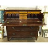 An antique mahogany secretaire chest, the cockbeaded top drawer with hinged drop-down front