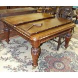 A Late-Victorian mahogany extending dining table on carved and fluted legs, with two leaves, 206 x