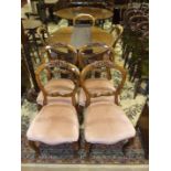 A set of four Victorian carved balloon-back dining chairs, three other similar chairs and a mahogany