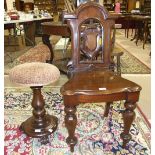 A Victorian mahogany hall chair, with pierced shield back on octagonal shaped front legs and a