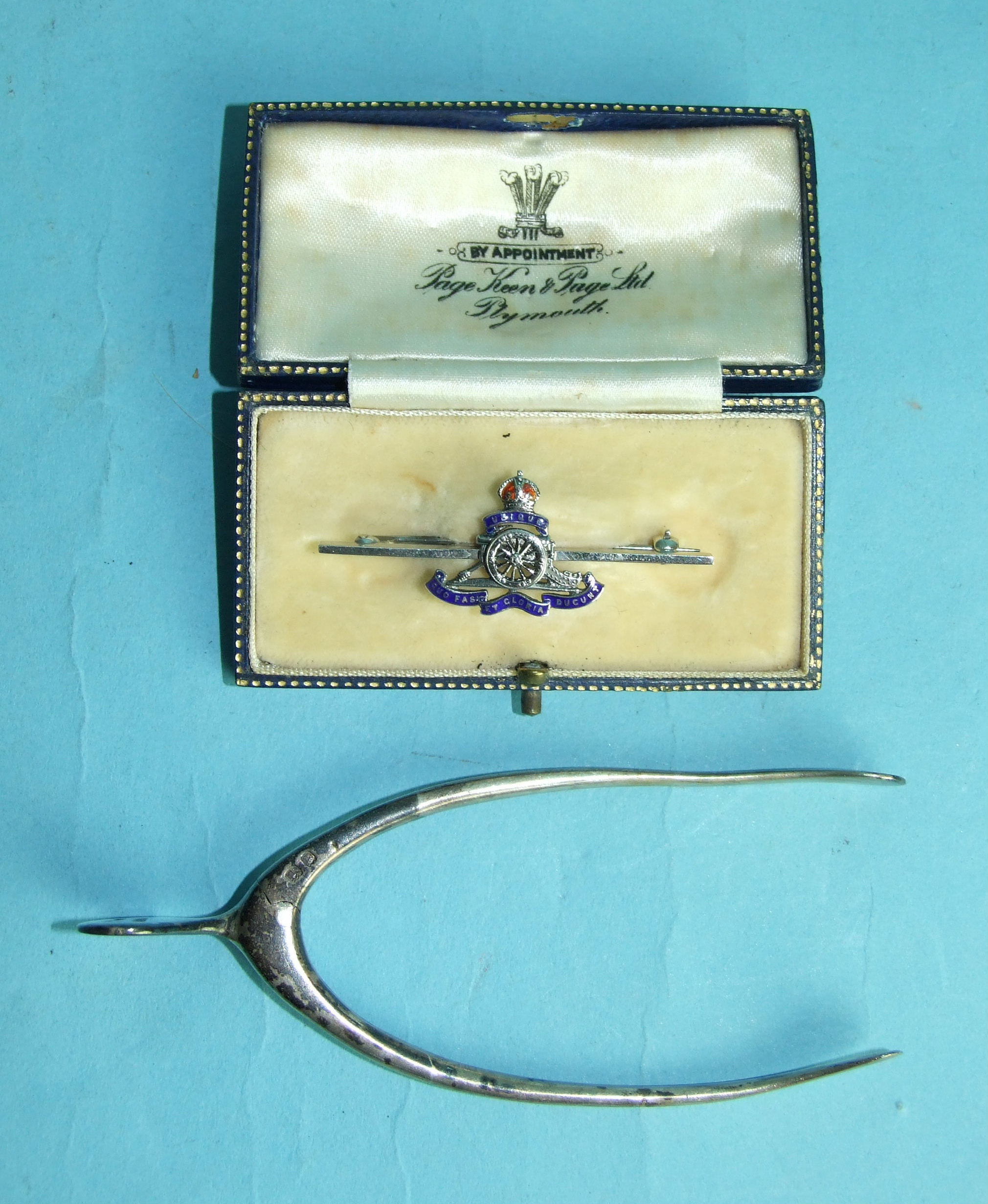 A pair of silver 'wishbone' sugar tongs, London 1929, by S Mordan & Co, together with a silver