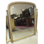 A Late-Victorian gilt-framed arched over-mantel mirror, 127 x 104cm.