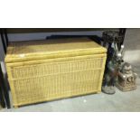 A large wicker basket, 85 x 44cm, 47cm high, a folding table and other items.