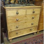 A similar pine chest of five drawers, 103cm wide, 97cm high.