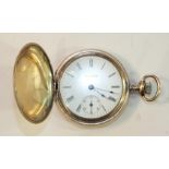 A gold-plated hunter-cased Waltham pocket watch with white enamel dial, Roman numerals and seconds