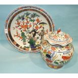 A large 18th century Imari-style charger and a Ming-style fish jar and cover, (2).