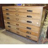 Six oak plan chest drawers in two sections, 115cm wide.