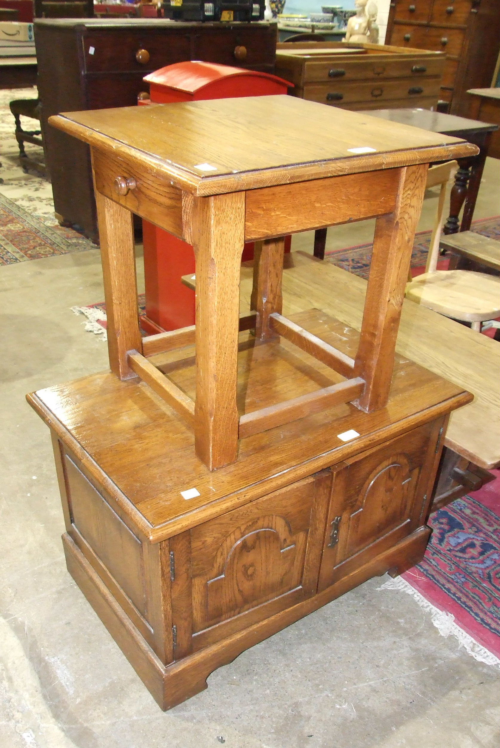 A square oak occasional table, 50cm, an oak coffee table and an oak television stand, (3).