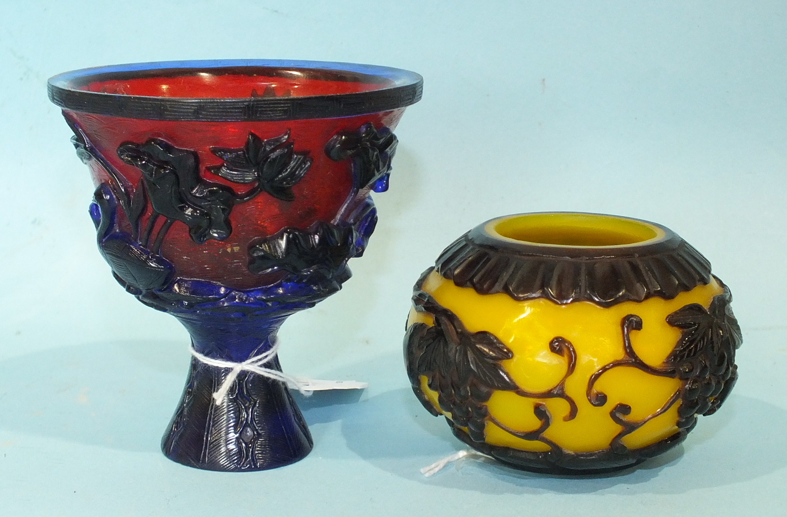 Two cameo-style Peking glass bowls, with vine, geese and fish decoration, (2).