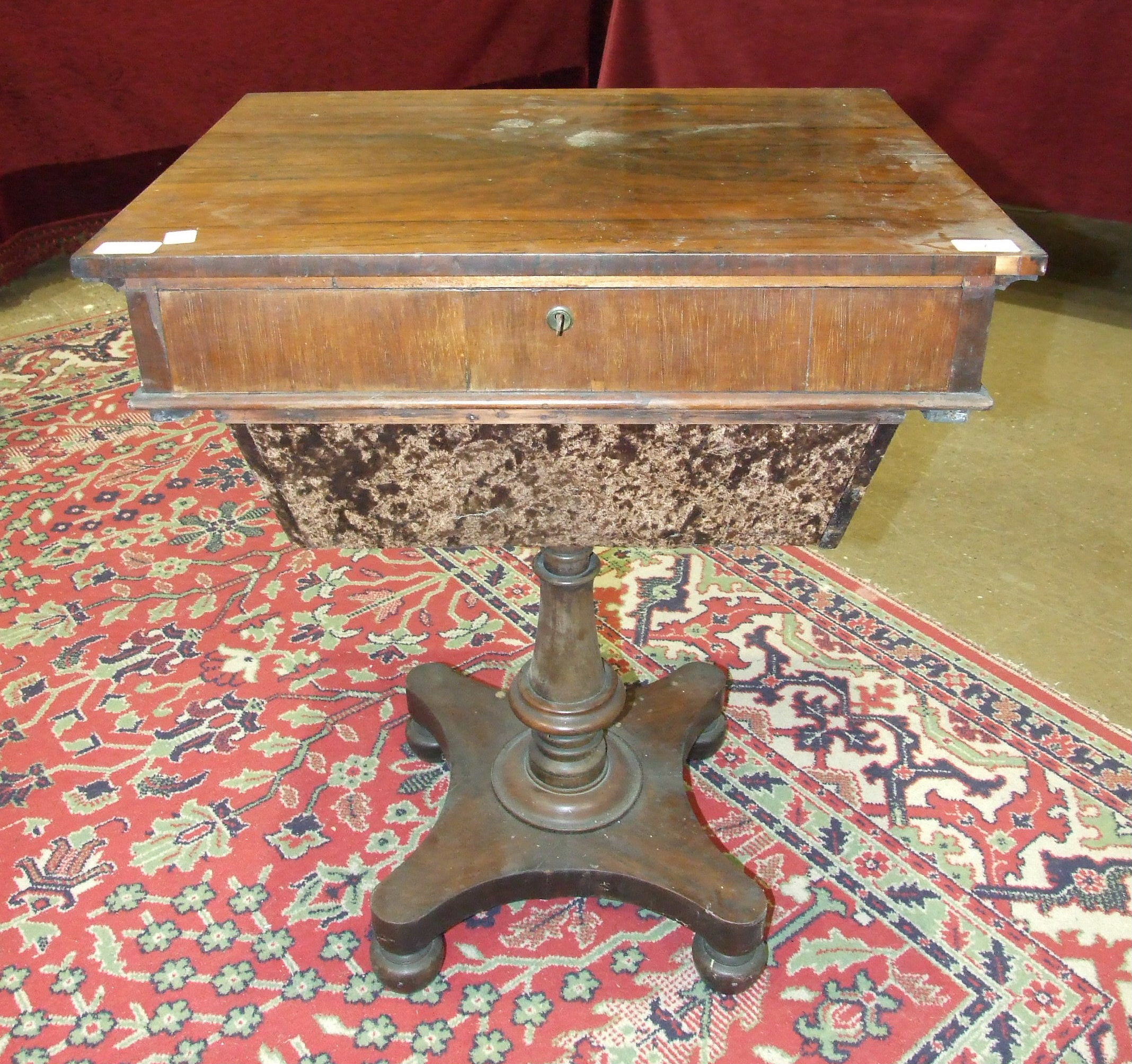 A William IV rosewood work box, having a single drawer and a sliding compartment, on turned column