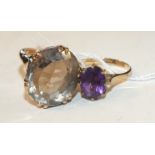 An amethyst ring in 9ct gold mount, size L, 2g and a large 9ct gold ring set smokey quartz, size