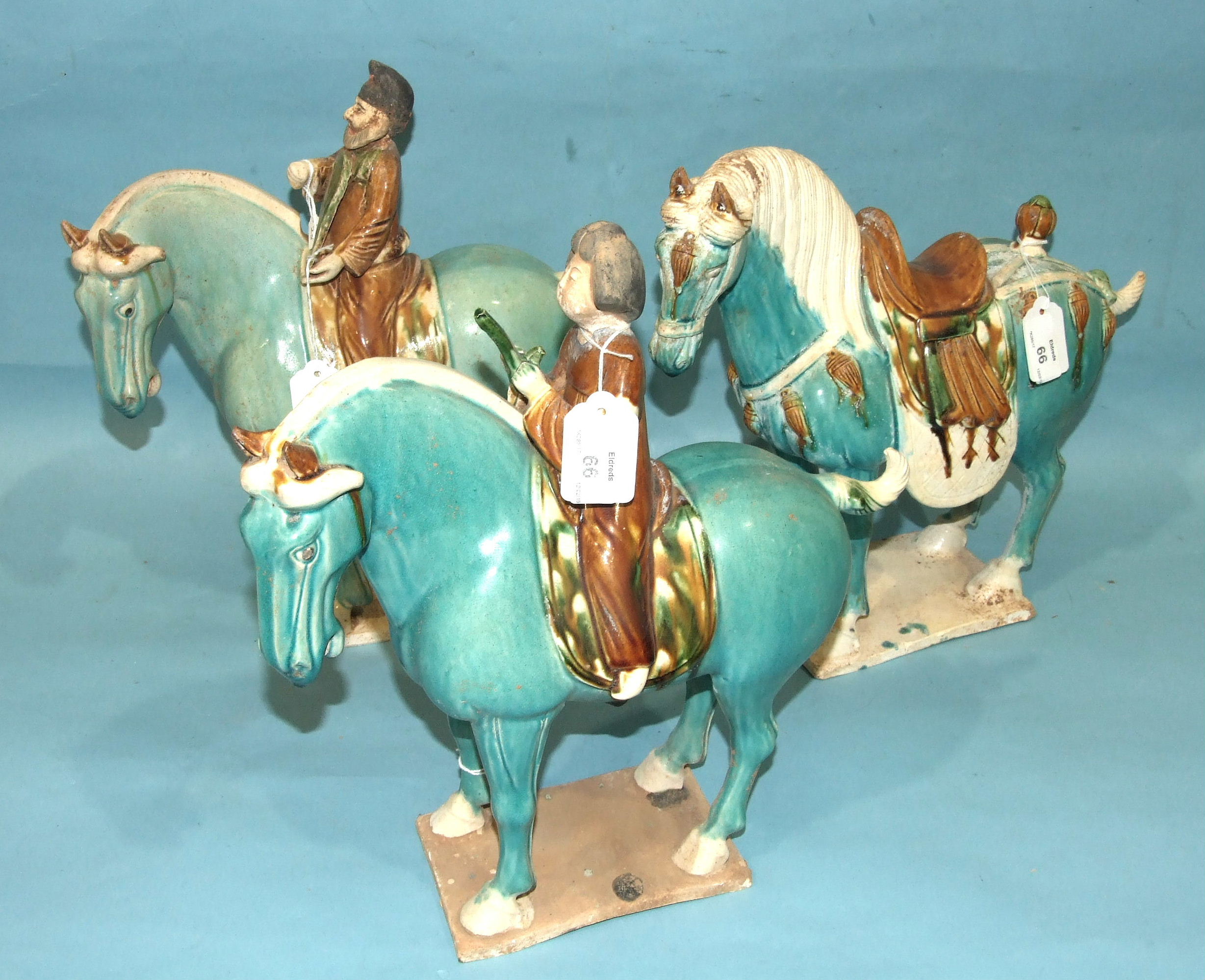 Three Tang-style earthenware sancai horses, two with riders, in a turquoise glaze. - Image 2 of 2