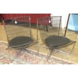 A pair of contemporary powder-coated basket chairs, on tubular chrome frames, each with seat pad, (