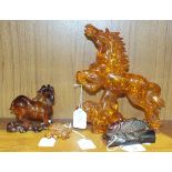 Four faux amber animal carvings, (4).