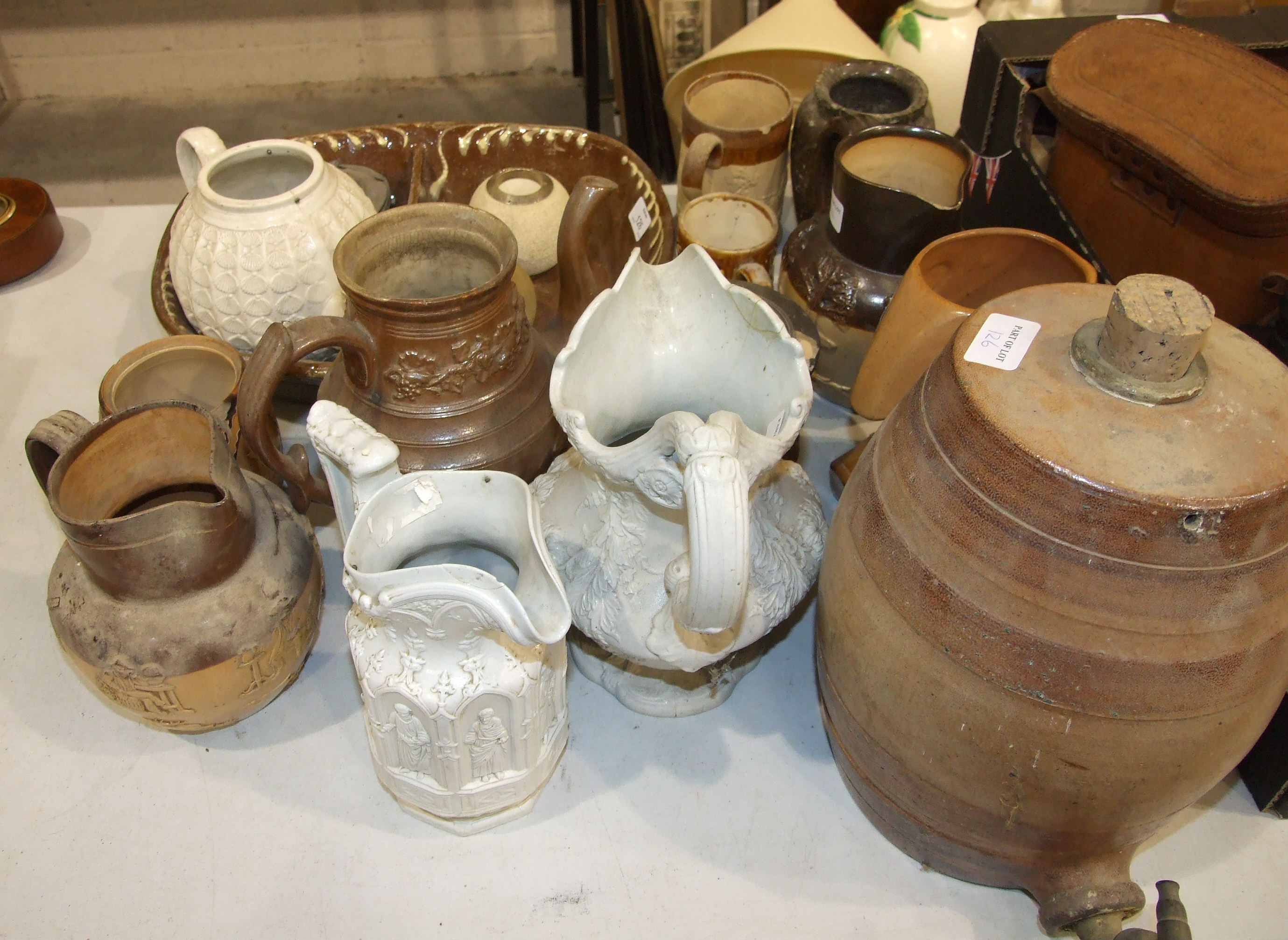 A 17th/18th century Bellarmine jug with incised mask and oval medallion, handle lacking, 24cm - Image 2 of 2