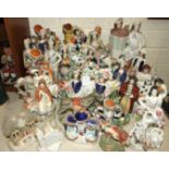 A collection of twenty-eight 19th century Staffordshire figures, pastille burners, etc, (damages and