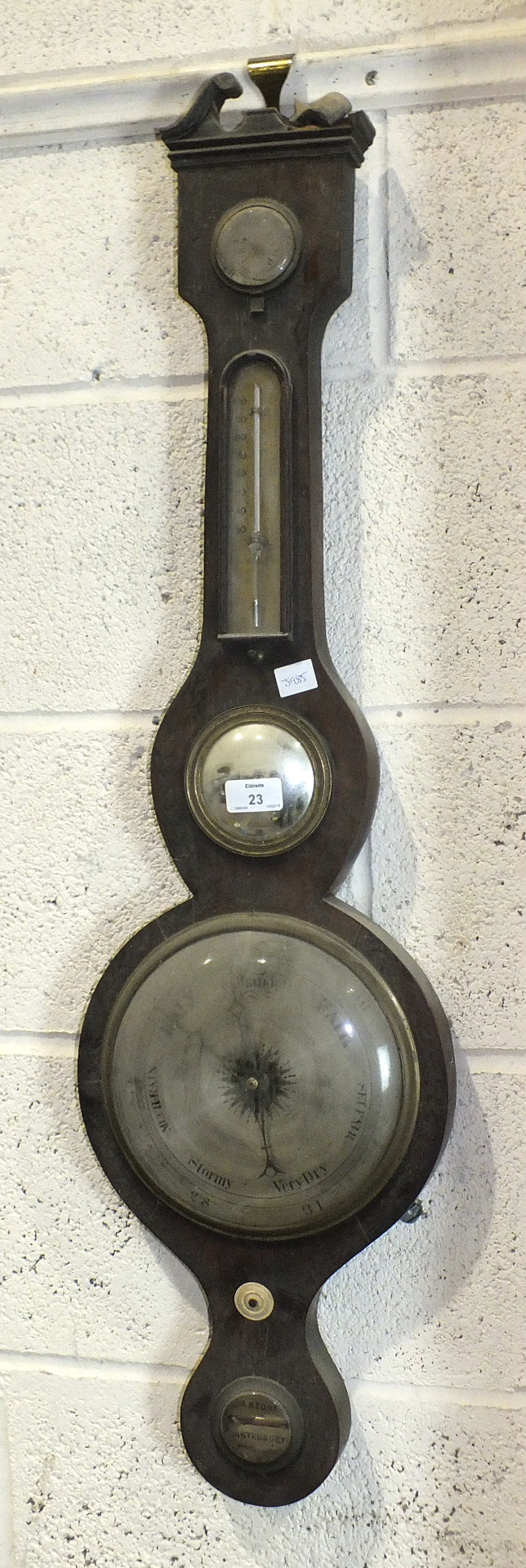 A mahogany banjo barometer by P Cattaneo & Co, London, with silvered dials, dry/damp, thermometer