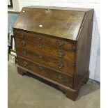 A 19th century mahogany bureau, the rectangular top and fall front above four drawers, on bracket