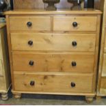 A pine cupboard fitted with a glazed door, 52.5cm wide, 108cm high, a smaller painted pine cupboard,