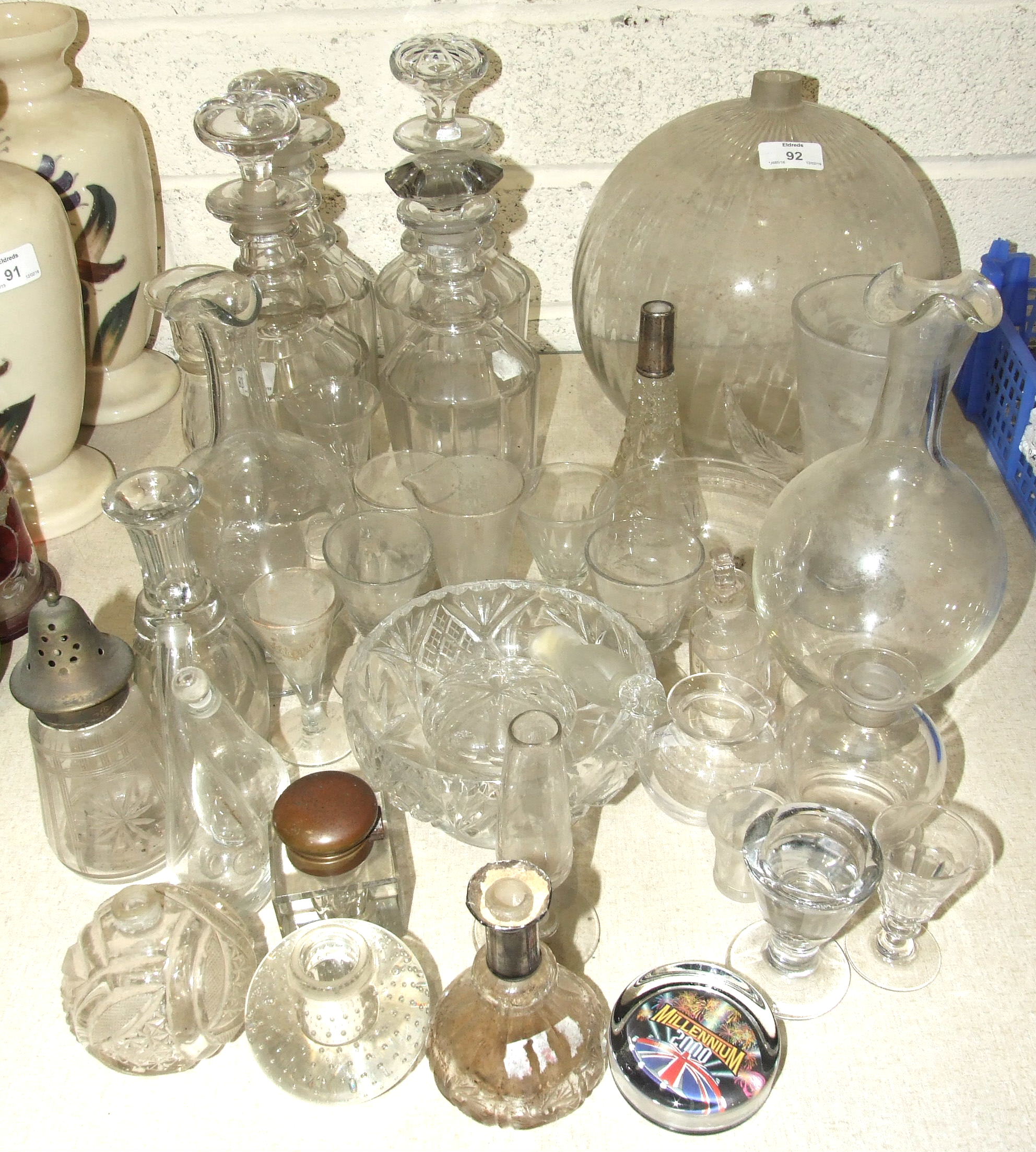 A set of four cut-glass decanters, (two with original stoppers), 27cm high and other glassware.