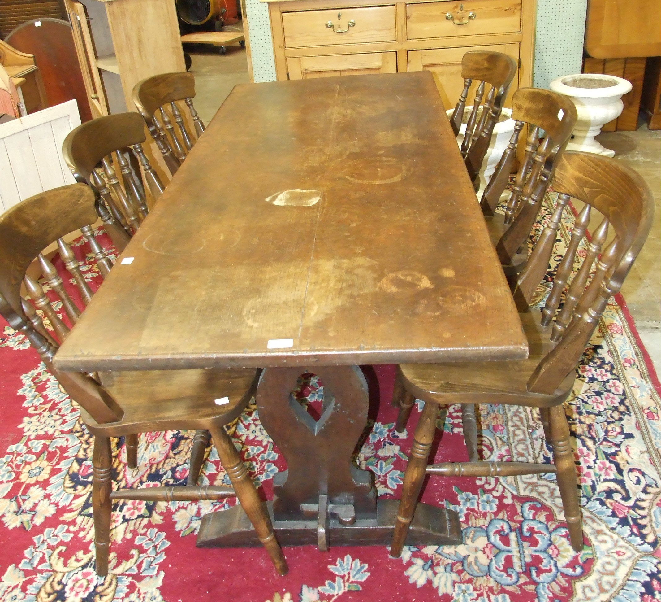 A modern oak refectory-style dining table, 183.5 x 74.5cm and six spindle-back dining chairs.