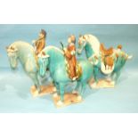 Three Tang-style earthenware sancai horses, two with riders, in a turquoise glaze.