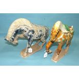 Two Tang-style earthenware horses in sancai colours, blue-glazed, (2).