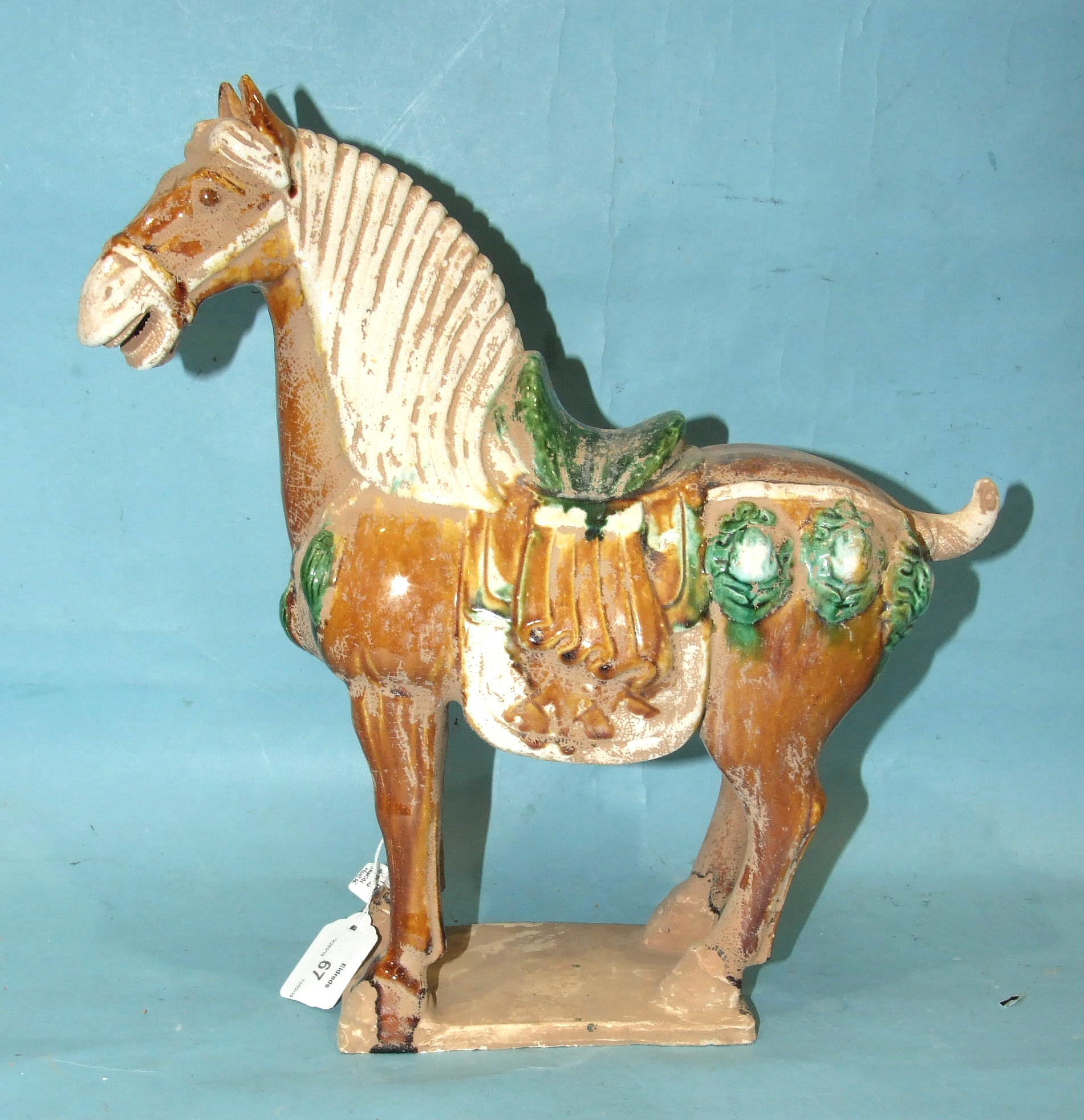 Three Tang-style earthenware horses, one with gilded decoration, (3). - Image 2 of 2