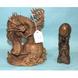 A carved boxwood dragon-form brush washer and a carved wood figure of an immortal, (2).