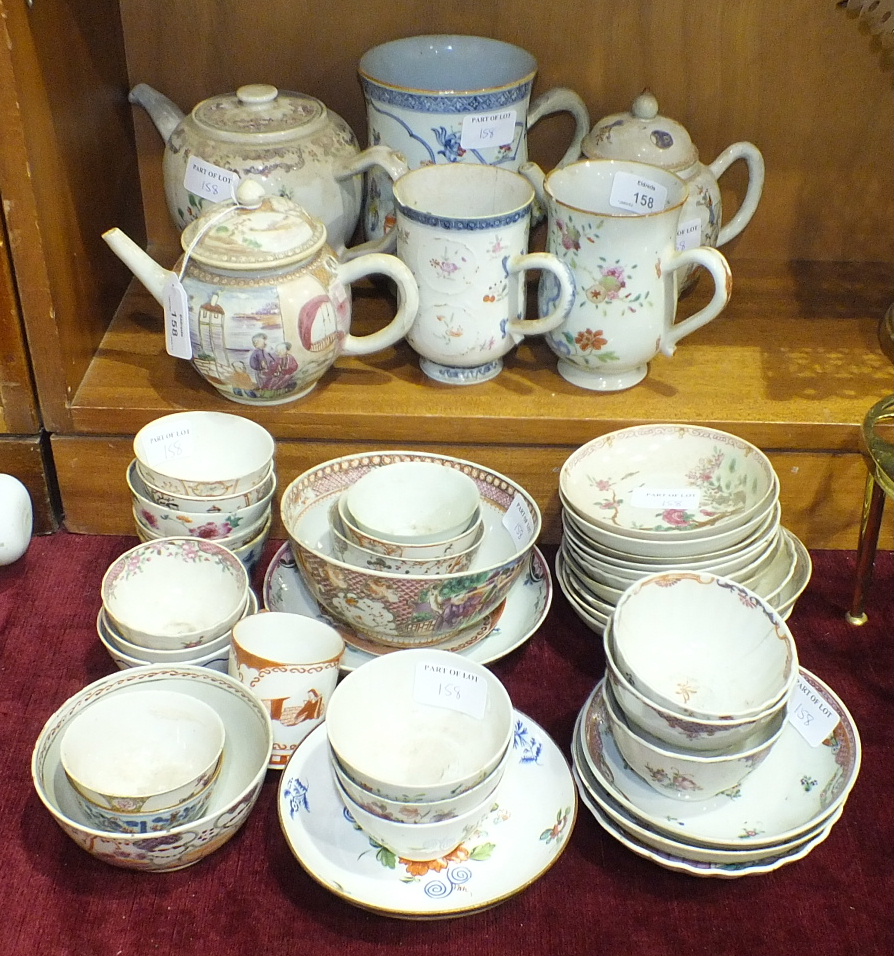 A collection of Oriental tea bowls and saucers, mugs and teapots, (damages to most pieces).