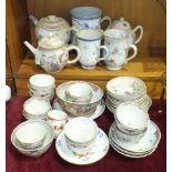 A collection of Oriental tea bowls and saucers, mugs and teapots, (damages to most pieces).
